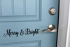 Merry and Bright Christmas horizontal script lettering vinyl decal displayed on front door for holiday decorating