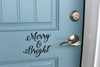 Merry and Bright Christmas vinyl decal with elegant script lettering displayed on front door for holiday decorating