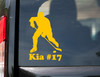 Personalized ice hockey player silhouette vinyl decal with hockey stick, puck and custom name beneath the design, available in nine sizes from 3 x 4.5 inches to 20 x 30 inches with mirror option and 12-character name personalization