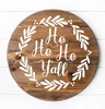 Ho Ho Ho Y'all Christmas vinyl window decal featuring Southern holiday script lettering surrounded by a circular leafy wreath with decorative berry accents