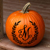 Personalized monogram vinyl decal featuring a custom initial letter surrounded by a classic laurel wreath