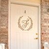 Personalized monogram vinyl decal featuring a custom initial letter surrounded by a classic laurel wreath