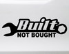 Built Not Bought wrench vinyl decal showing bold automotive lettering with a classic hand tool symbol in solid black on a white background
