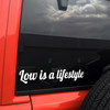 Low Is A Lifestyle vinyl decal featuring bold stance culture text celebrating lowered suspension and modified car builds
