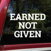 Earned Not Given vinyl decal featuring bold motivational lettering emphasizing discipline and earned success on a white background