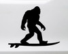Bigfoot surfing vinyl sticker decal showing a playful Sasquatch riding a surfboard in a beach themed silhouette design