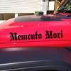 memento mori vinyl sticker decal featuring classic roman serif typography and latin stoic philosophy phrase promoting purposeful living
