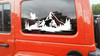 mountain dragon vinyl sticker decal featuring a flying dragon above rugged mountain peaks and pine forests designed for rvs campers travel trailers and teardrop campers