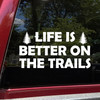 life is better on the trails vinyl decal featuring pine trees and bold lettering designed for trucks, suvs, campers, overland rigs, and outdoor adventure vehicles