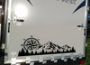 Mountain Compass Rose Forest vinyl decal featuring rugged mountain peaks, evergreen trees, and a compass rose for trucks, RVs, campers, travel trailers, SUVs, and overland vehicles.