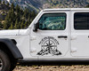 Not All Who Wander Are Lost vinyl decal featuring a compass rose, mountain range, and evergreen forest for RVs, campers, trucks, SUVs, travel trailers, and overland vehicles.