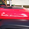 Pair of beach hood side vinyl decals featuring an ocean wave, tropical island, palm trees, seabirds, and a setting sun for trucks and SUVs.