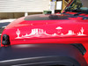 Pair of desert UFO abduction vinyl decals featuring mesas, saguaro cacti, and an alien spacecraft for trucks, campers, RVs, and travel trailers.