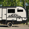 Denali Mount McKinley vinyl decal featuring rugged Alaska mountain scenery and evergreen forest displayed on an RV camper exterior