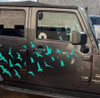 25 flying bird vinyl decal set arranged across Jeep doors and vehicle body panels