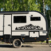 Mount Elbert Colorado Rocky Mountains panoramic vinyl decal with rugged mountain peaks and evergreen pine forest silhouette displayed on a travel trailer camper
