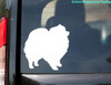 Pomeranian vinyl decal featuring a standing fluffy Pom Pom dog silhouette with curled tail, available in multiple sizes and mirror orientation
