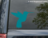 Flying Hummingbird Silhouette vinyl decal featuring a solid-color bird in flight with extended wings, long beak and tail feathers, shown on an SUV window, available in eight sizes from 2.5 x 1.5 to 30 x 22.5 inches with 4-pack, 2-pack and mirror options