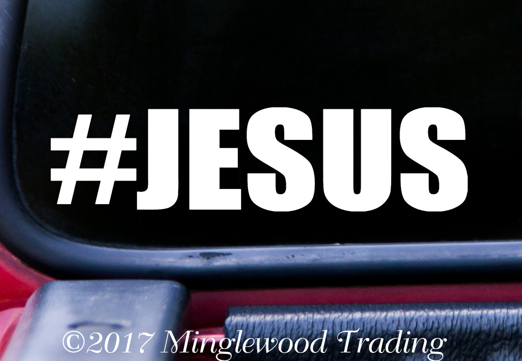 #JESUS vinyl sticker decal with bold hashtag typography applied to car window with minimalist Christian design
