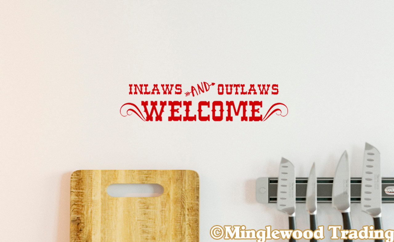 'Inlaws and Outlaws Welcome' vinyl decal on a wall - perfect funny door sign and humorous welcome decal for any space