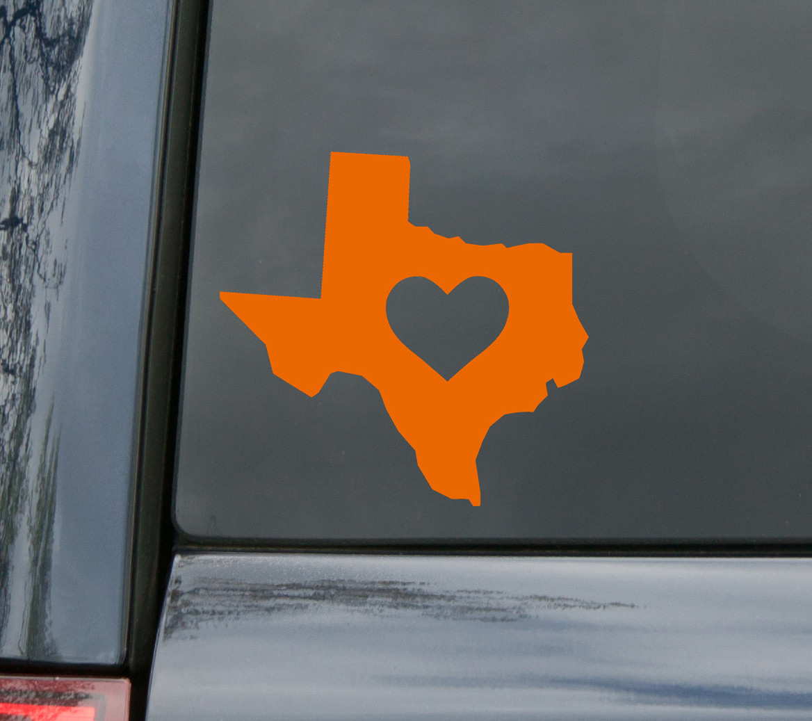Texas-shaped vinyl decal with a heart in the center on a window - ideal Texas heart decal and I Love Texas sticker
