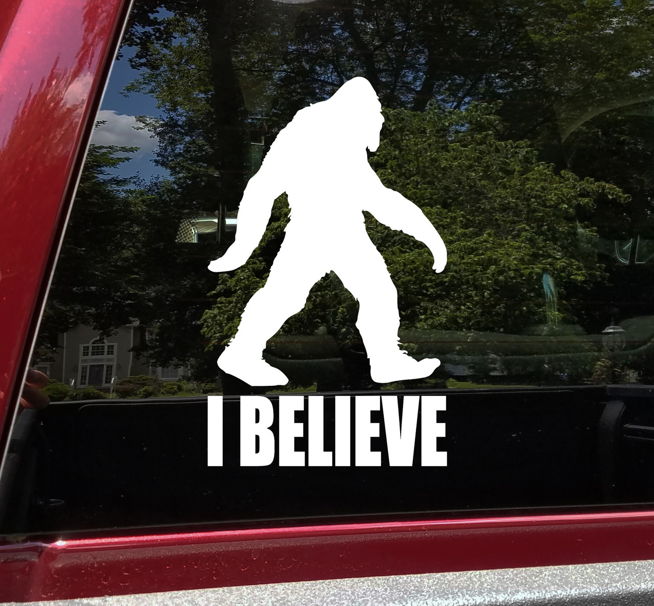 I Believe Bigfoot Sasquatch vinyl decal featuring a walking hairy cryptid silhouette above bold I BELIEVE lettering for cars trucks RVs and campers