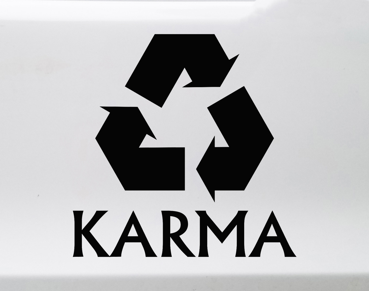 Karma vinyl decal featuring a three-arrow recycling symbol above KARMA lettering