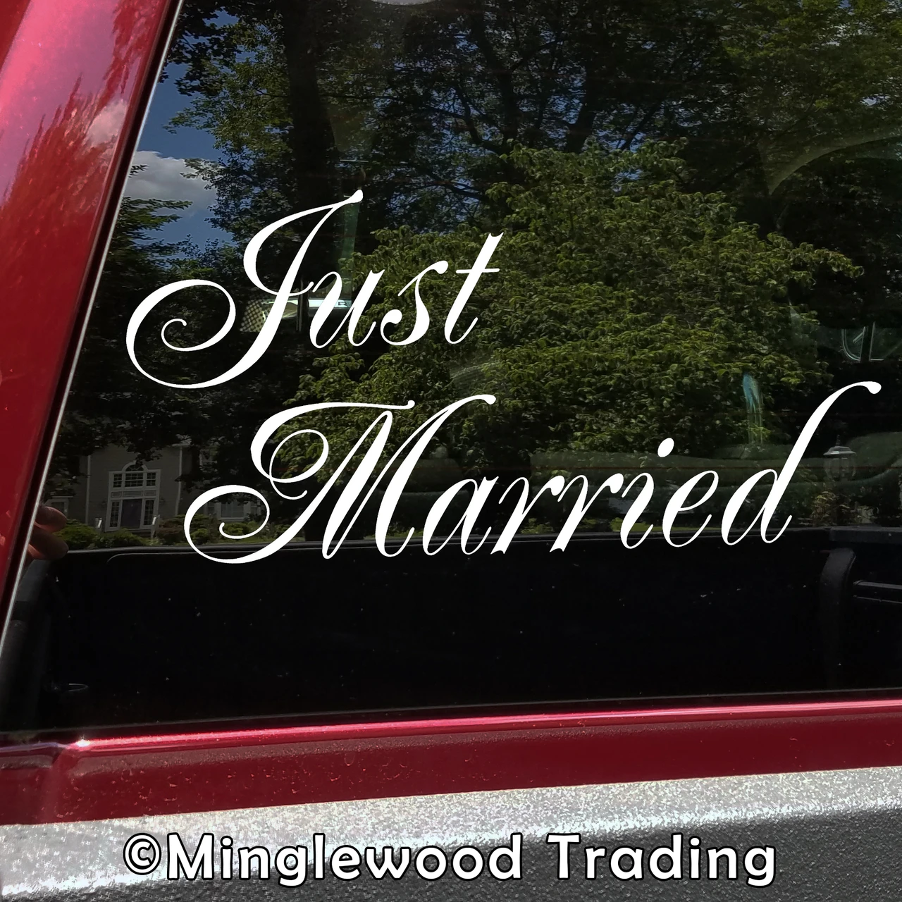 Just Married vinyl decal with elegant flowing script lettering and decorative flourishes for wedding getaway cars