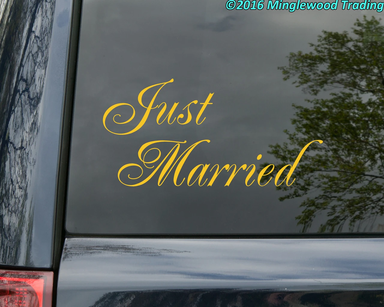 Just Married vinyl decal with elegant flowing script lettering and decorative flourishes for wedding getaway cars