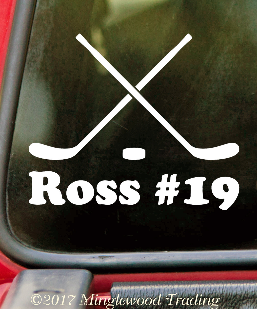 Personalized crossed hockey sticks and puck vinyl decal with custom player name and jersey number, available in six sizes from 4 x 3.25 inches to 15 x 12 inches