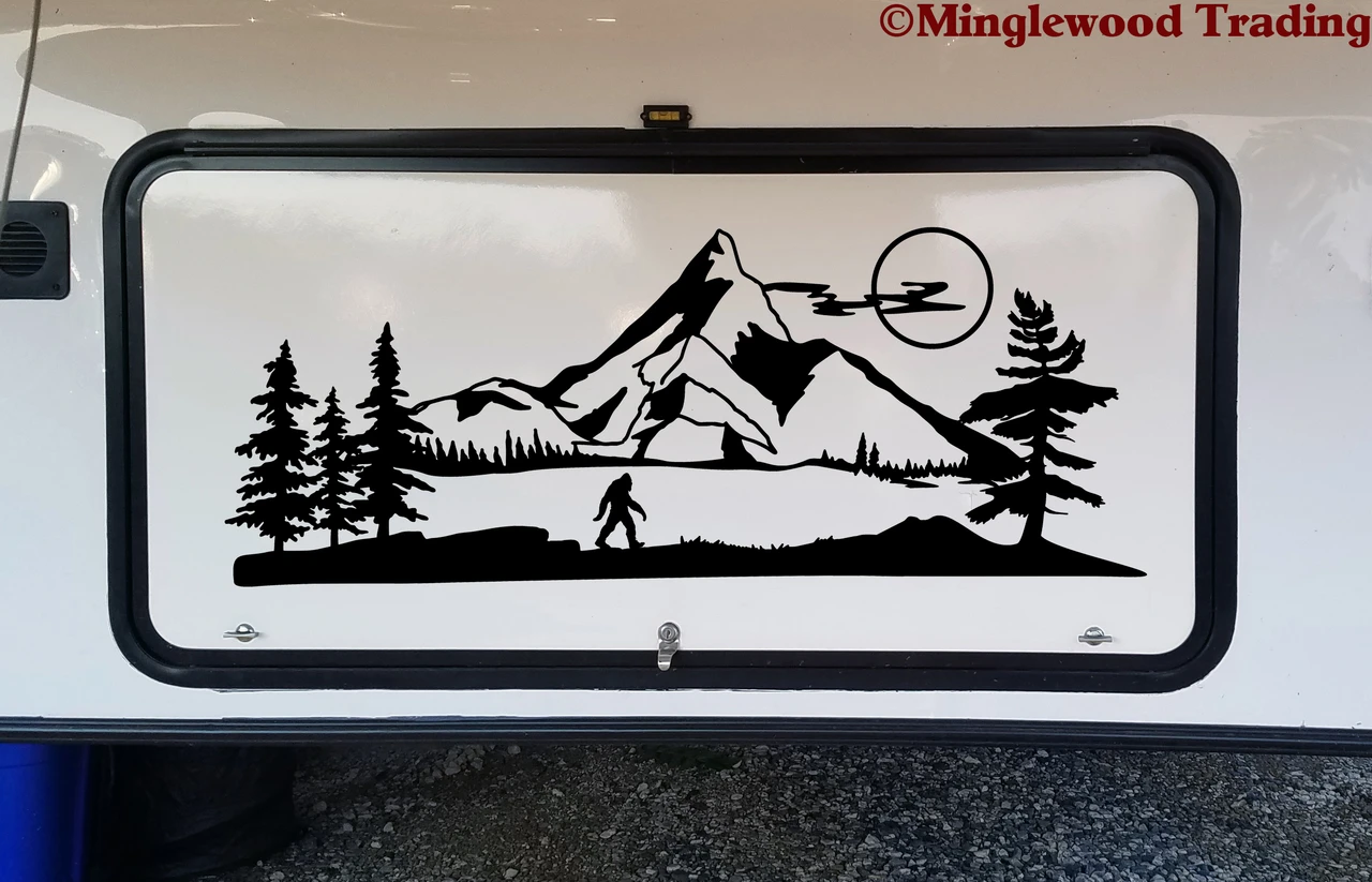 Bigfoot Sasquatch moon mountain landscape vinyl decal featuring walking cryptid silhouette, full moon, mountain peaks, pine trees and lake for RV campers and travel trailers