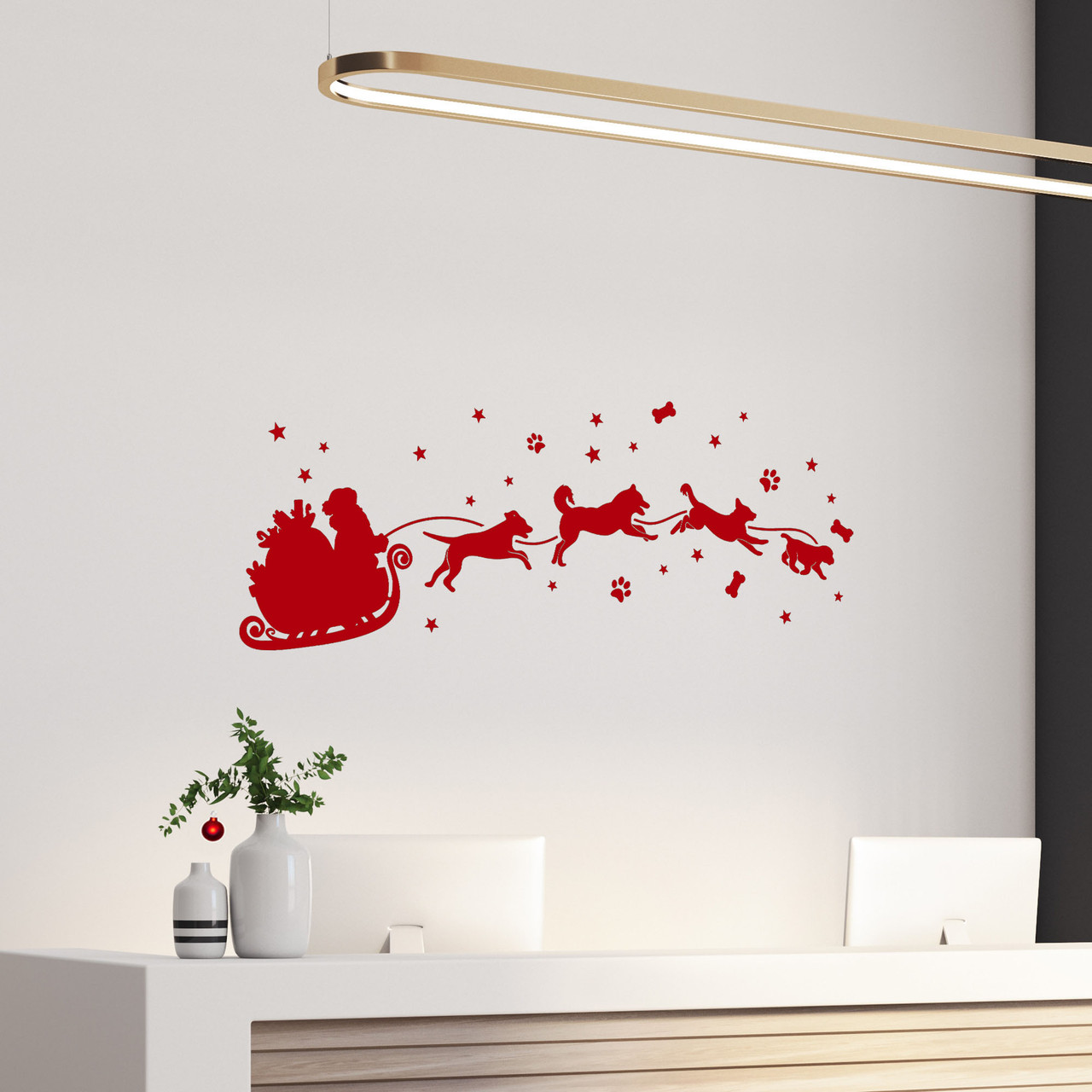  Christmas vinyl decal of Santa Claus in a sleigh pulled by running dogs with stars, paw prints and dog bones on a glass window