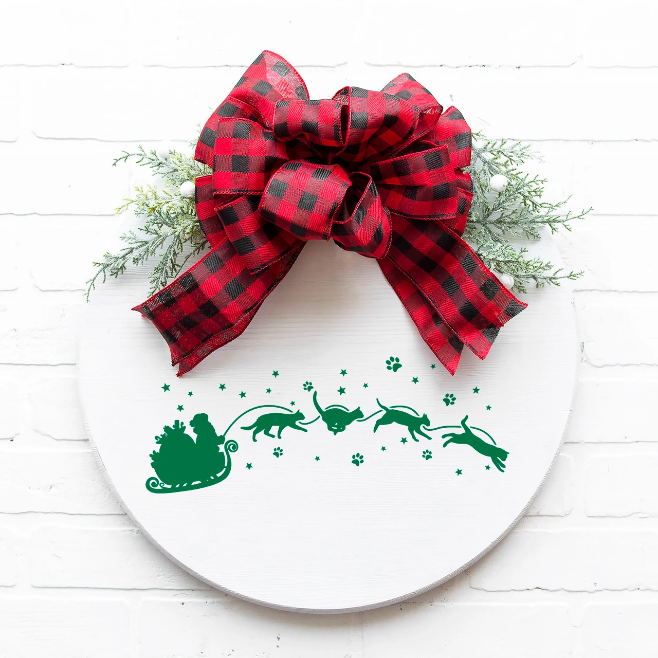  Christmas vinyl window decal featuring Santa Claus in a gift-filled sleigh pulled by four running and jumping cats surrounded by stars and paw prints