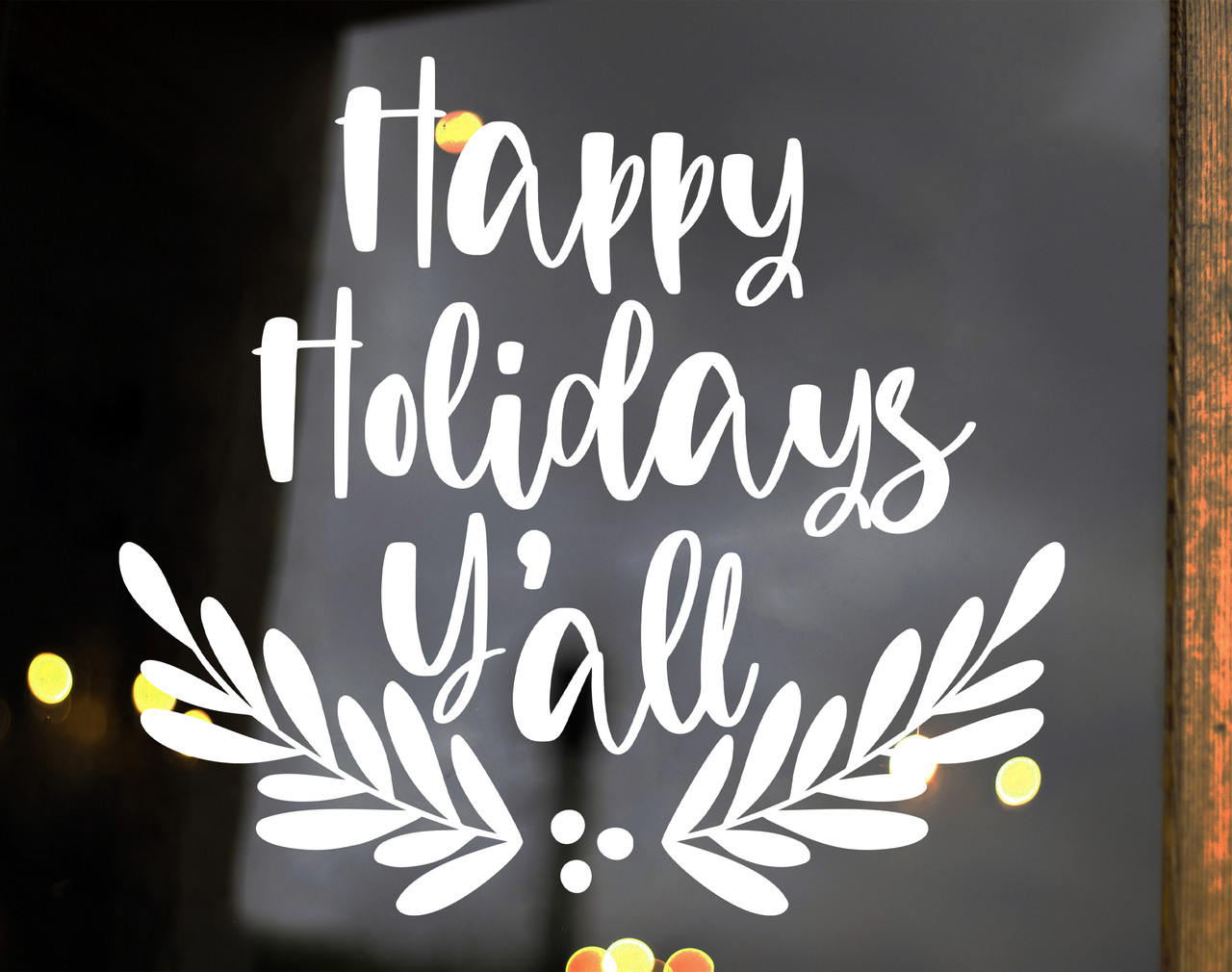 Happy Holidays Y'all vinyl window decal featuring Southern holiday script lettering with symmetrical leafy branches and decorative berry accents