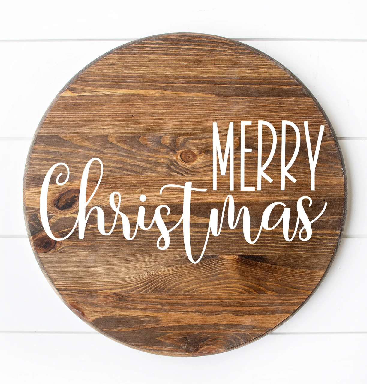 Merry Christmas vinyl window decal featuring tall uppercase MERRY lettering above flowing cursive Christmas script with decorative flourishes