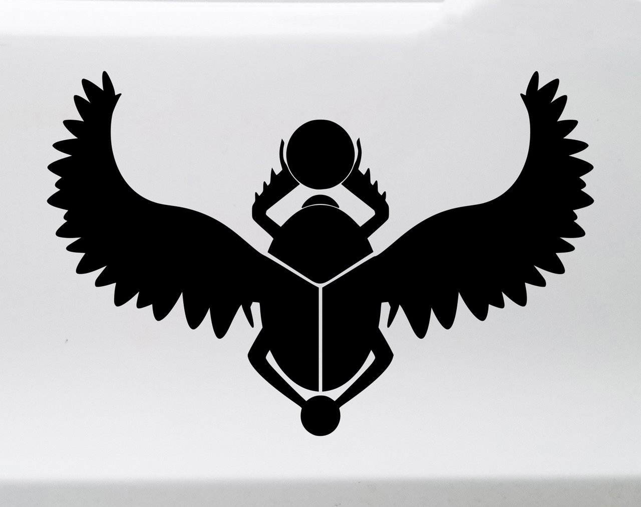 Egyptian winged scarab beetle vinyl decal with spread feathered wings and sun disk inspired by ancient Egyptian mythology and sacred scarab symbolism