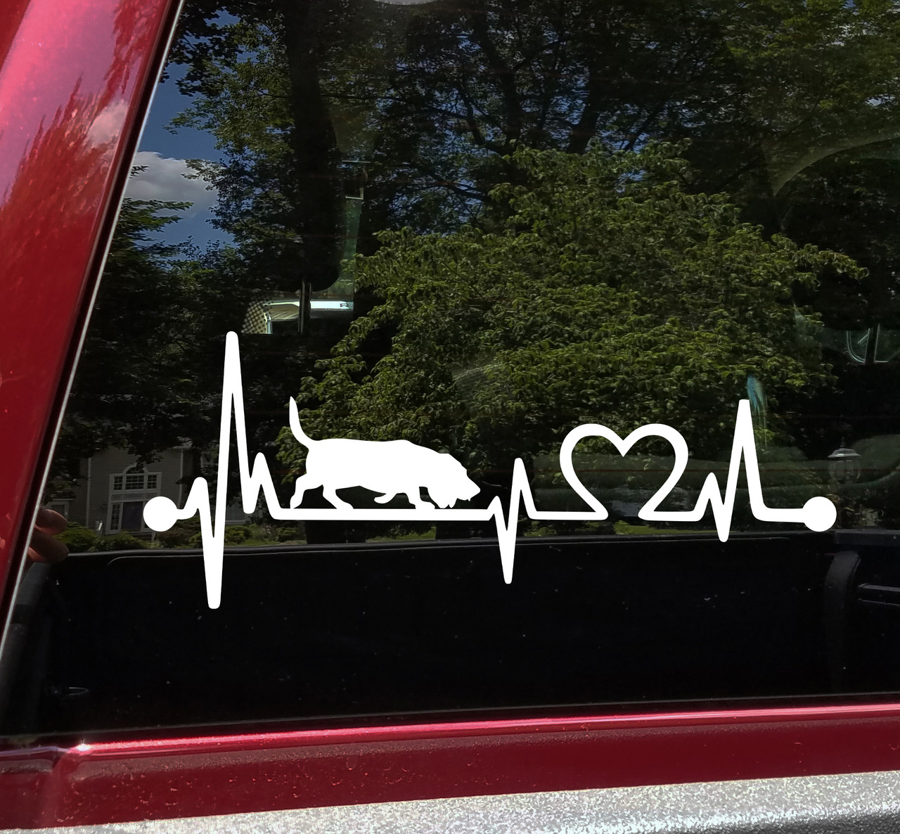 Basset Hound Love Heartbeat vinyl decal featuring a dog silhouette with EKG pulse line and heart symbol, available in nine sizes with mirror option