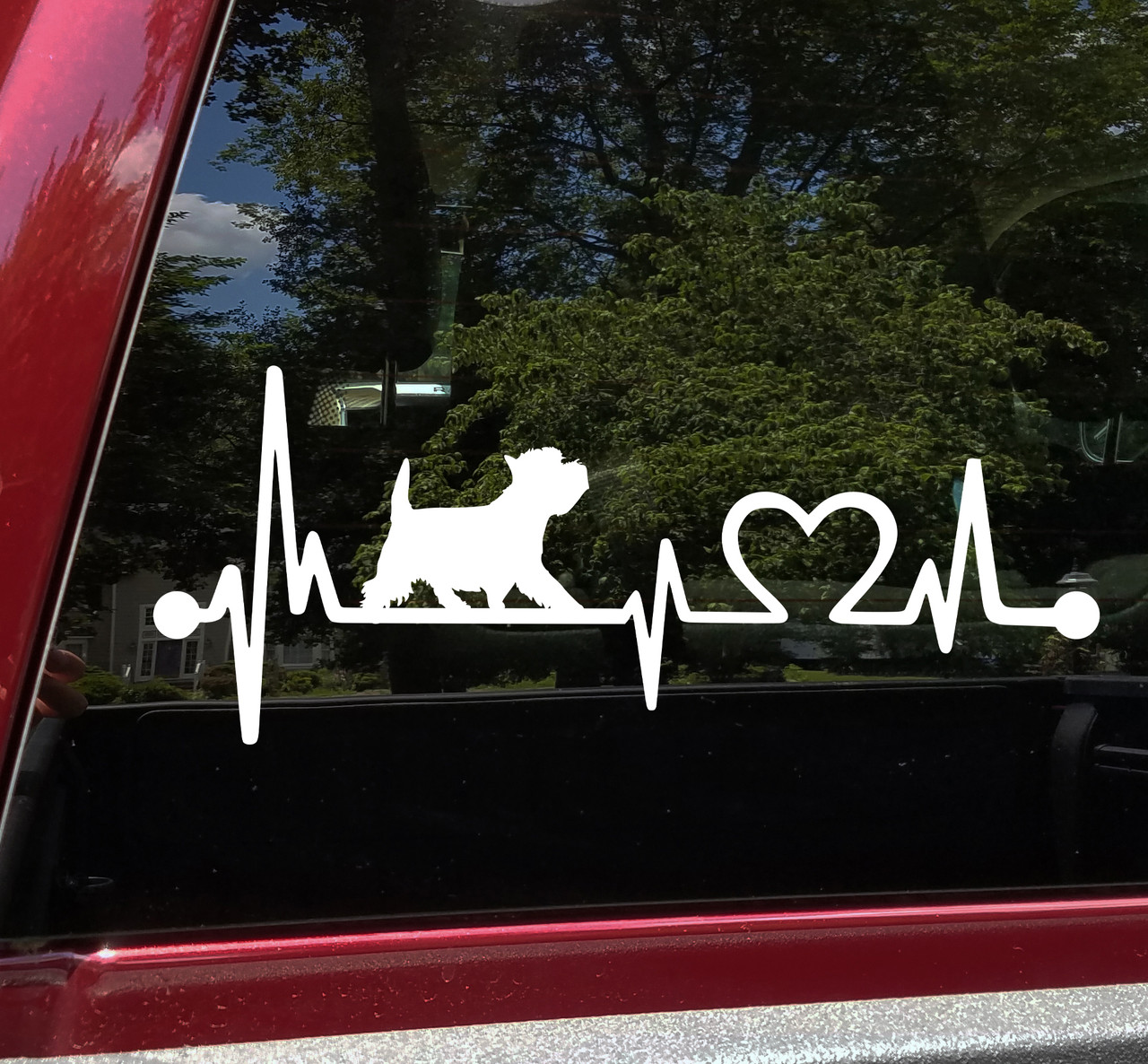 Westie Love Heartbeat vinyl decal featuring a walking West Highland White Terrier silhouette with EKG pulse line and heart symbol, available in nine sizes with mirror option