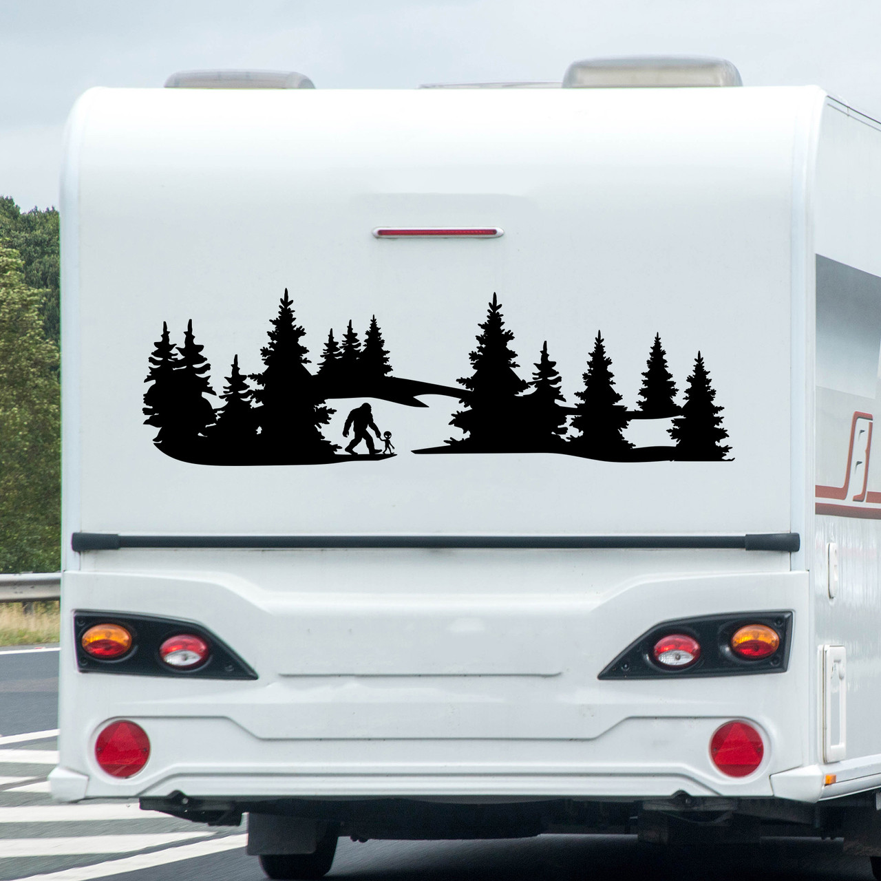 Vinyl decal of Bigfoot and alien walking hand in hand in the forest - cryptid and UFO themed design