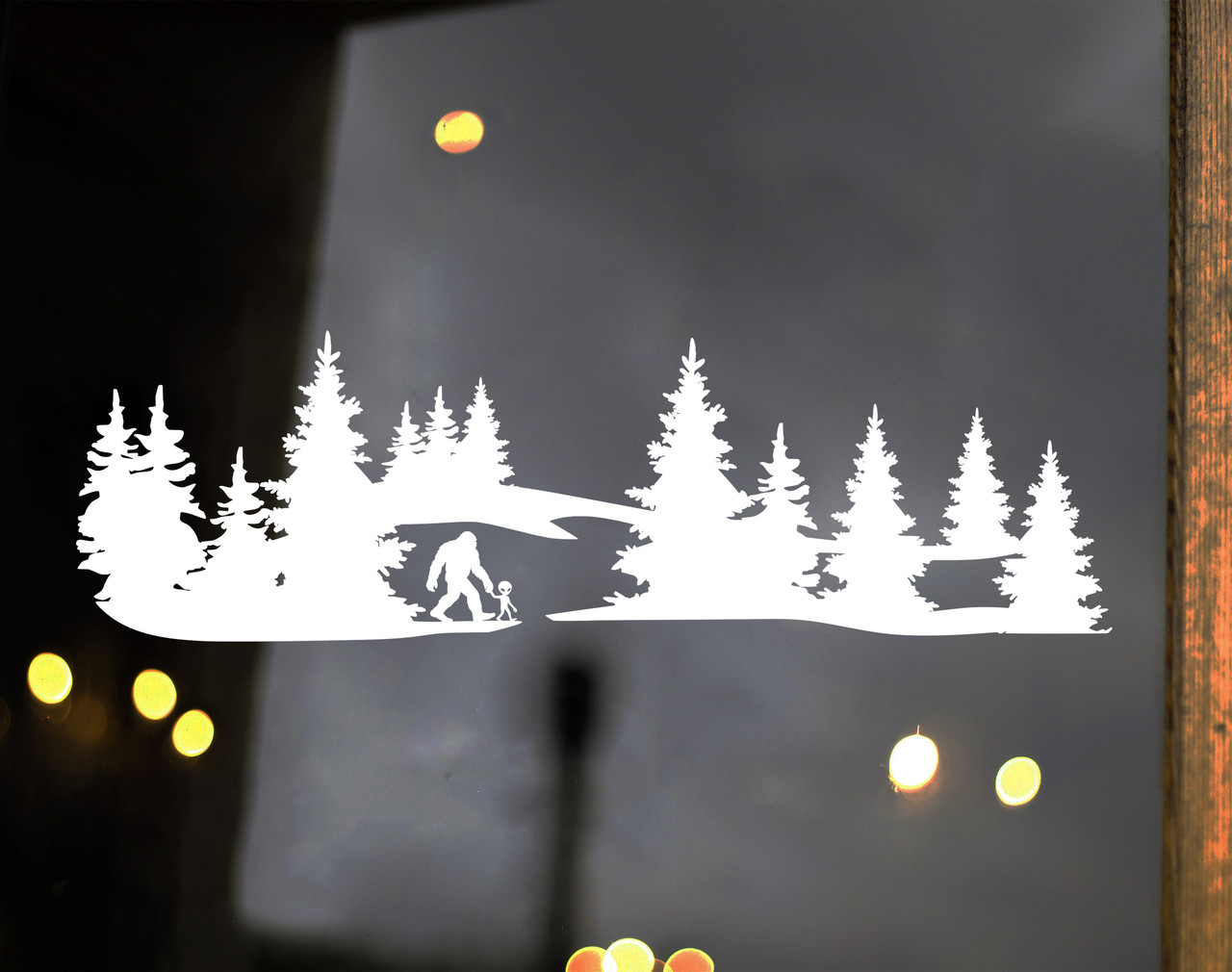 Vinyl decal of Bigfoot and alien walking hand in hand in the forest - cryptid and UFO themed design
