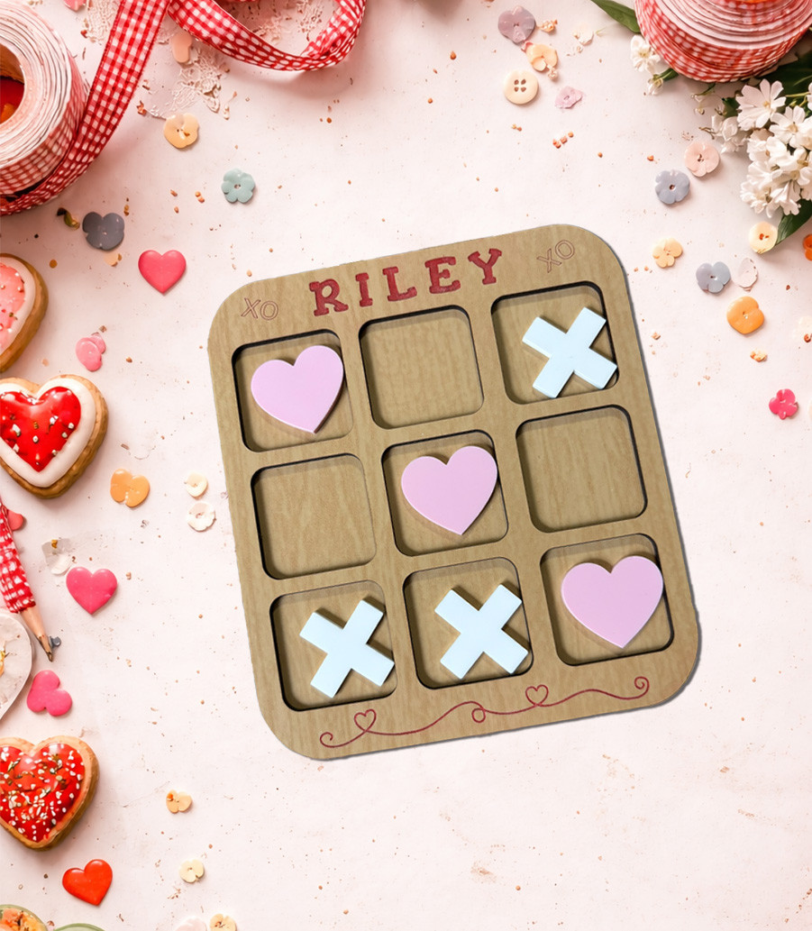 Valentine’s Day tic tac toe SVG game board with heart pieces and X tokens for laser cutting