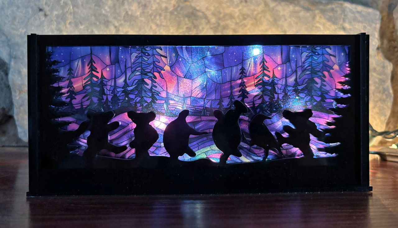 Moondance luminary SVG with dancing bears and turtles in a circular laser cut lantern design