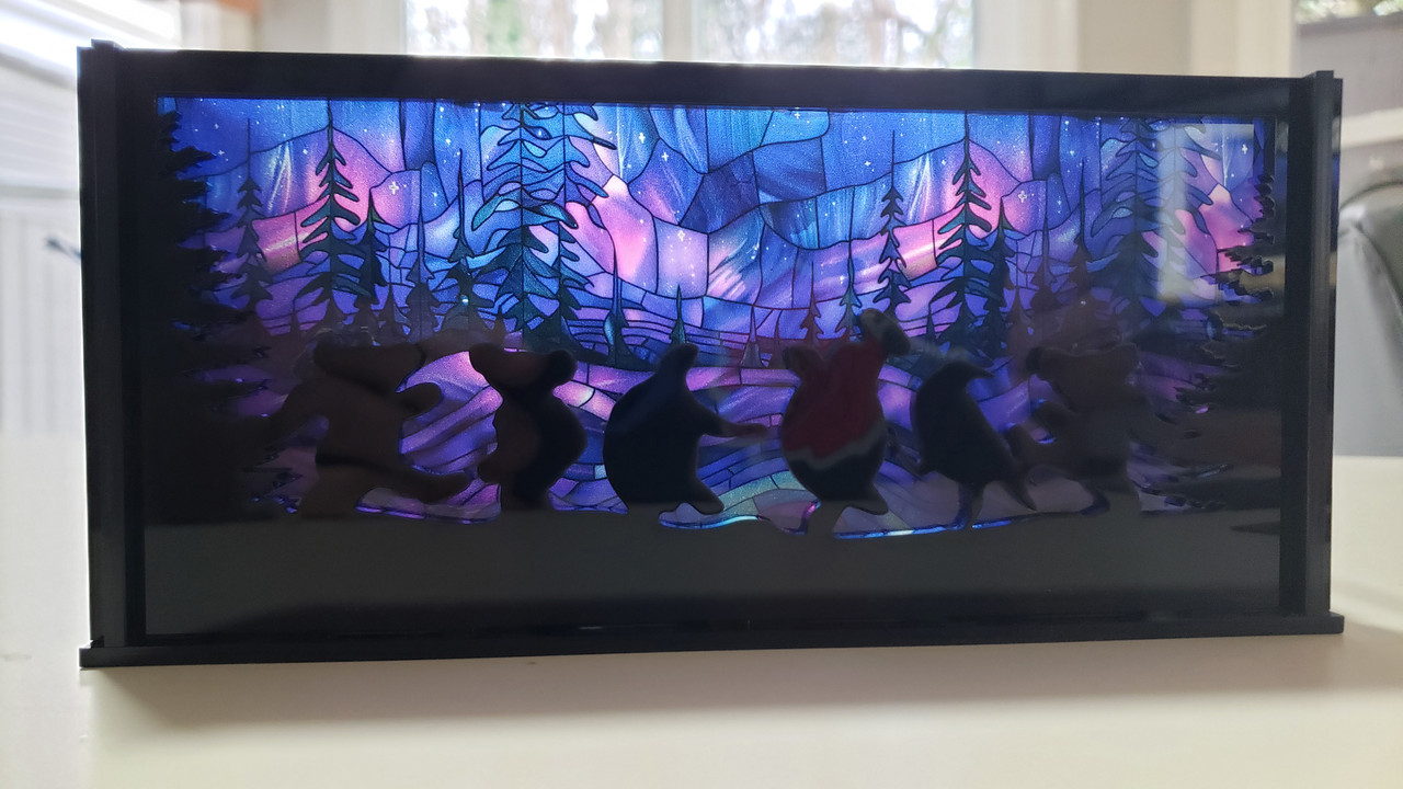 Moondance luminary SVG with dancing bears and turtles in a circular laser cut lantern design