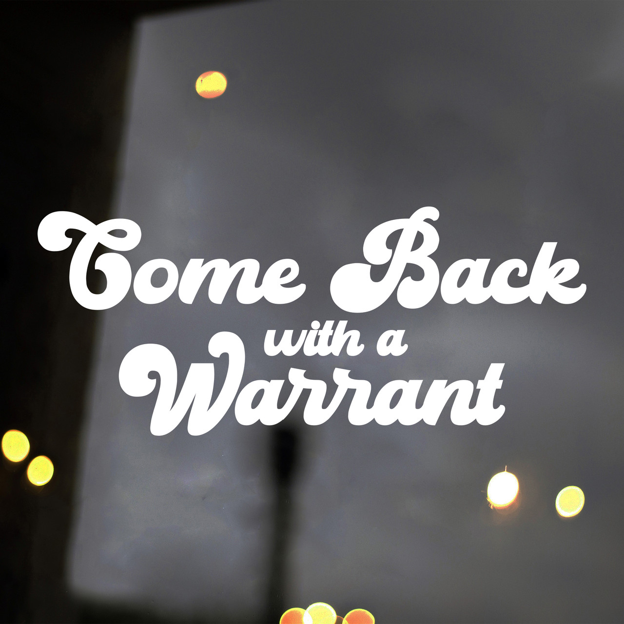 Come Back With A Warrant vinyl decal showing bold black text lettering in a clean, high-contrast design on white background