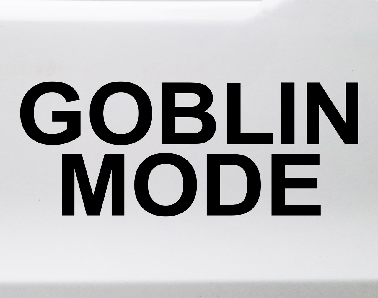 Goblin Mode vinyl decal featuring bold black text with chaotic meme style lettering on a clean white background