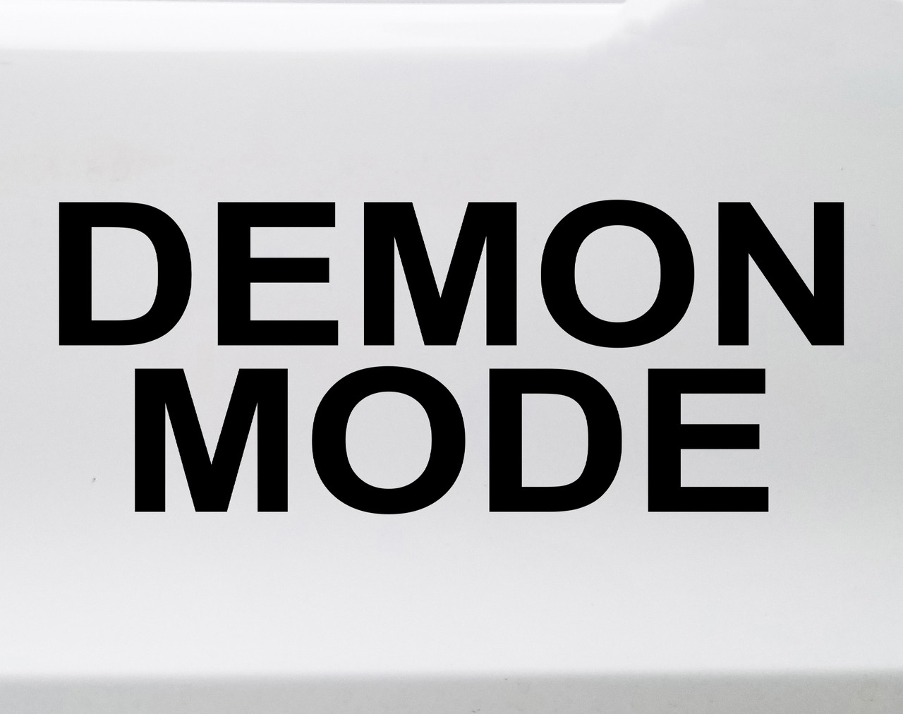Demon Mode vinyl decal featuring bold black text with chaotic meme style lettering on a clean white background