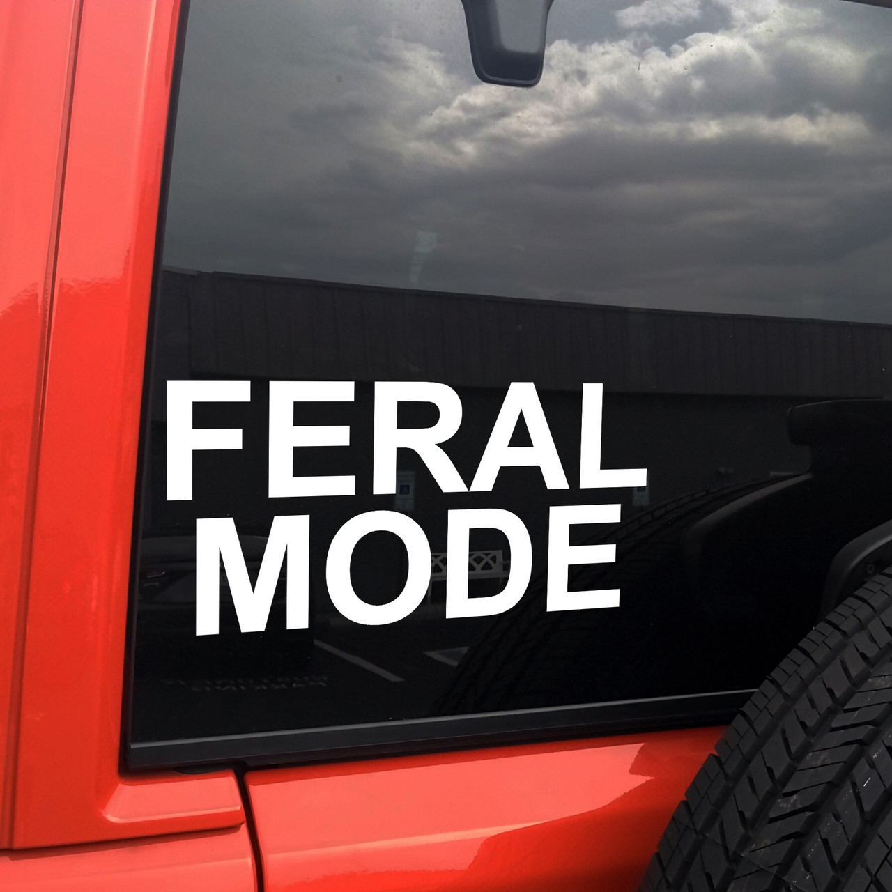 Feral Mode vinyl decal featuring bold black text with chaotic meme style lettering on a clean white background