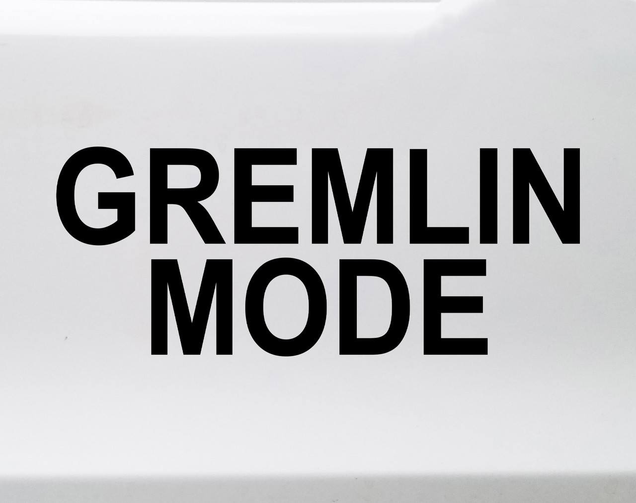 Gremlin Mode vinyl decal featuring bold black text with mischievous chaotic meme styling on a clean white background
