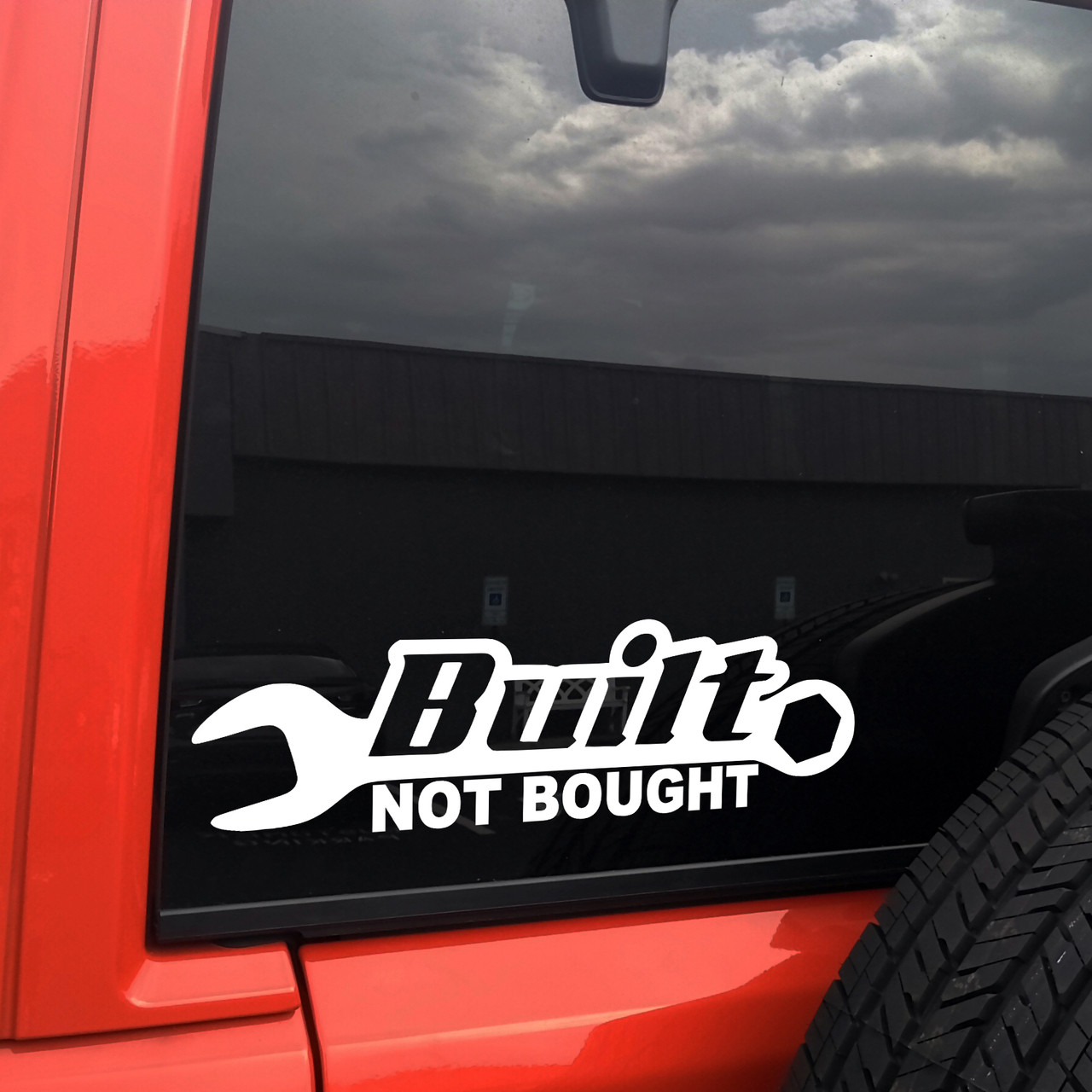 Built Not Bought wrench vinyl decal showing bold automotive lettering with a classic hand tool symbol in solid black on a white background