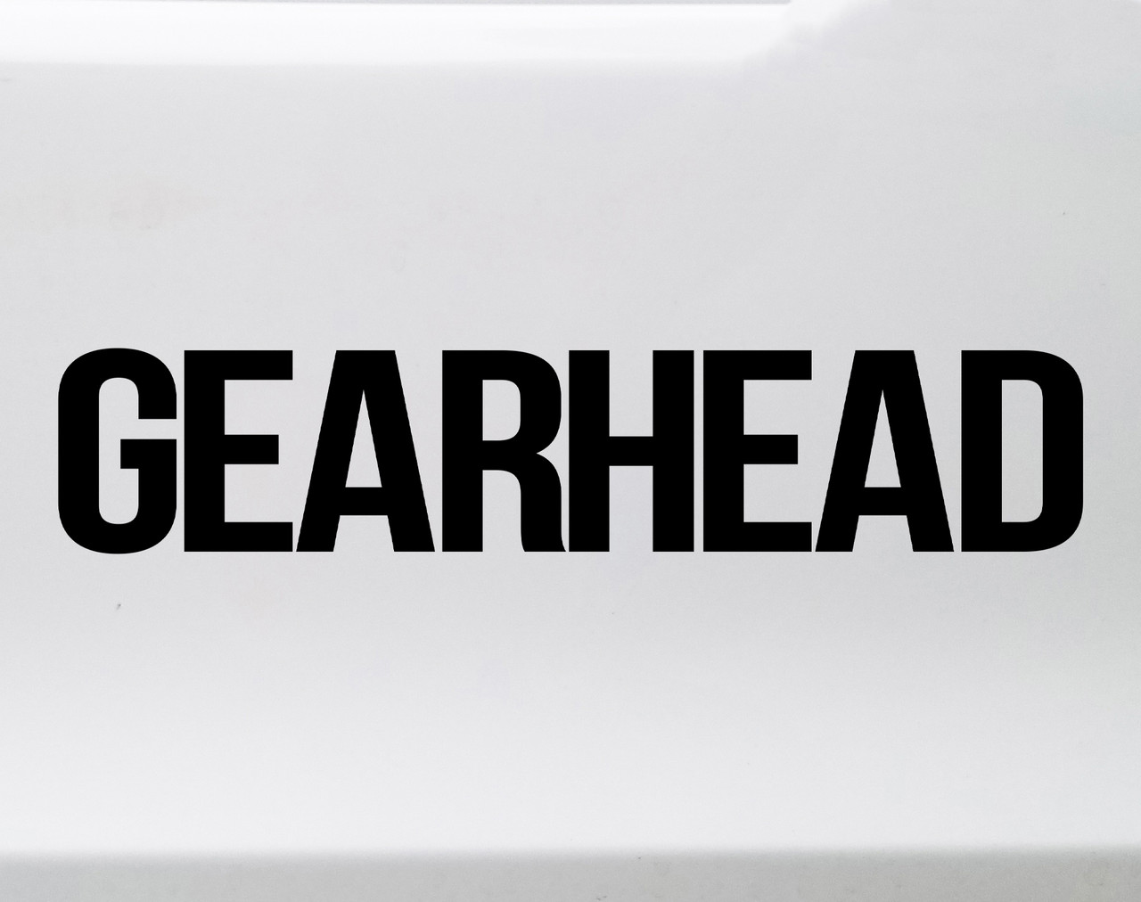 Gearhead vinyl decal featuring bold lettering designed for automotive, motorcycle, racing, and fabrication garage culture